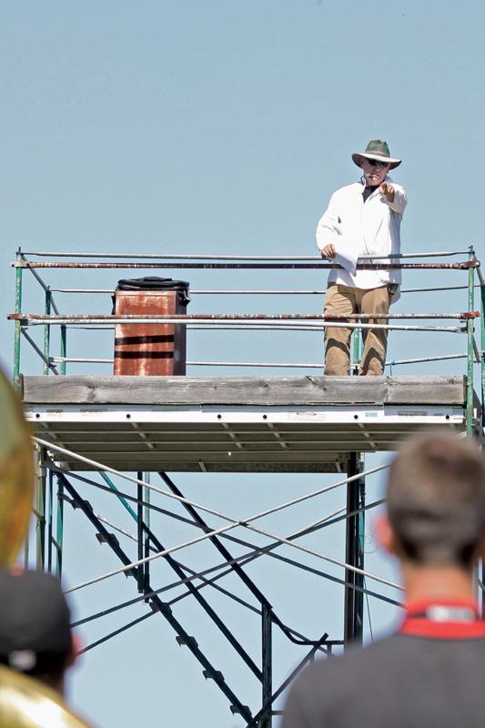Bulldog Marching Band director David Fullmer points out directions during a Monday practice. The marching band will be performing their first show of the season during the Bulldogs’ football season opening game on Sept. 1.  
Roe Borunda / The Collegian