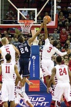 Junior Kevin Olekaibe (3) goes in for a basket over Deonte Burton (24) during the Bulldogs’ 68-61 conference loss to Neavada at the Save Mart Center. Olekaibe is averaging 8.2 points per game. Roe Borunda / The Collegian