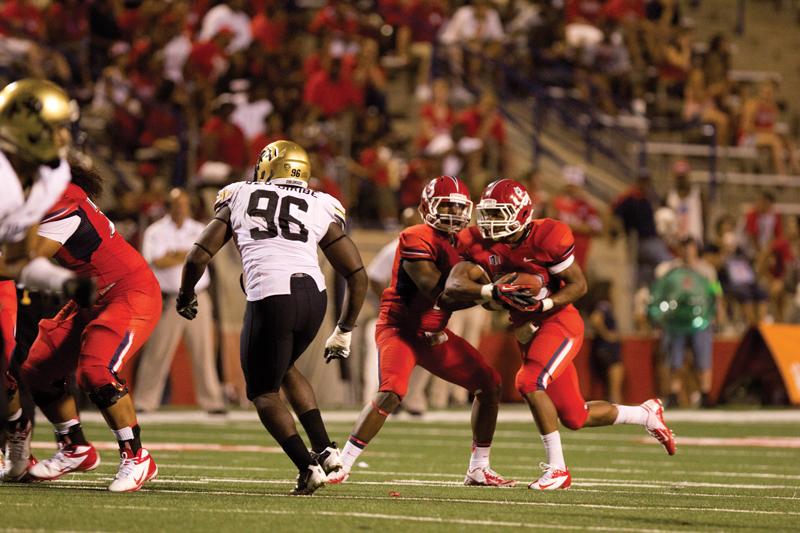 Running back Marteze Waller (33) receives a handoff from quarterback Greg Watson (10) during Fresno State’s 69-14 nonconfernce win against Colorado on Sept. 15. As a true freshman, and part of coach Tim DeRuyter’s first recruiting class at Fresno State, Waller received the second most carries (41) out of the Bulldogs’ running backs. Roe Borunda / The Collegian