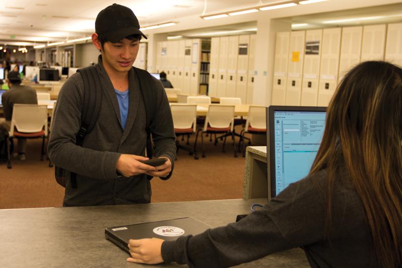 The library offers laptops and tablets to be checked out by students, like Ahsy Vang (above). The service can be found in the north wing of the first floor, but tablets are only available at the circulation desk.
Roe Borunda / The Collegian