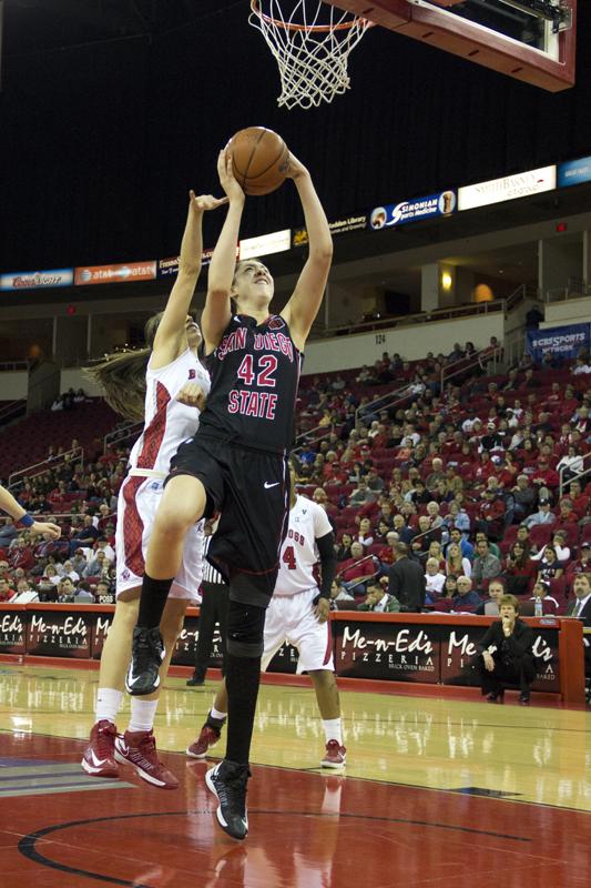 San Diego State's Malia Nahinu goes in for a layup during the Bulldogs' 74-49 Mountain West Conference loss Saturday night at the Save Mart Center. Dalton Runberg / The Collegian