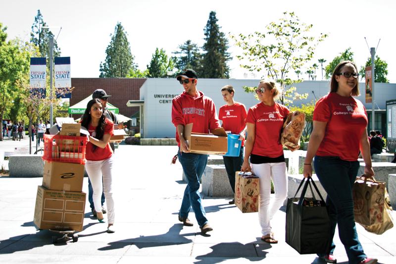 Fresno State’s College Republicans members deliver to the Henry Madden Library the books they received throughout the last year for their book drive. The books were donated by ringht-wing political organizations in the Central Valley.
Photo by Michael Price / The Collegian