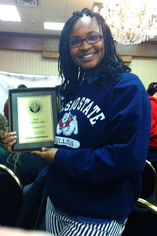 Fresno State’s Candis Tate holds one of the many awards earned by the debate team.
Photo Courtesy of Fresno State Department of Communication