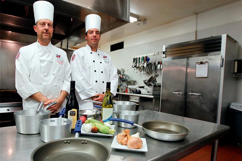 Fresno State Executive Chef Erik Debaude [right] and Sous Chef Bryan Kramer [left] in their Fresno State gear. 
