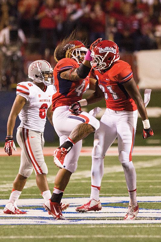 Fresno State’s Karl Mickelsen (left) and Ejiro Ederaine celebrate after a defensive stop during Fresno State’s win over UNLV Oct. 19. Photo by Roe Borunda/The Collegian