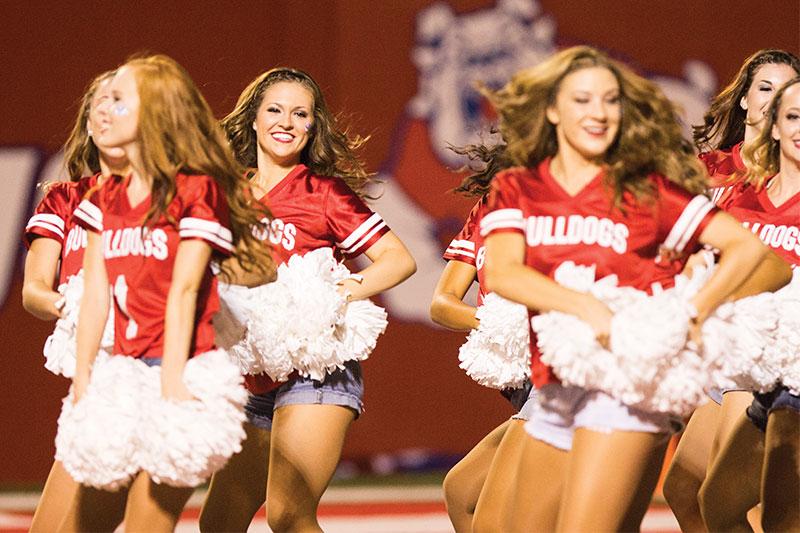 Roe Borunda / The Collegian

Members of the Fresno State cheer team showing their spirit at the Fresno State vs. Cal Poly game. The squad will host its annual Spirit Day fundraiser on Nov. 23.  For $25, head coach Emmi Jennings said children are taught a routine they will perform during halftime.