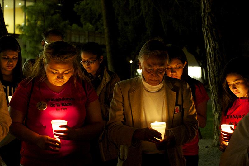 Fresno State students and members of the community held a moment of silence during the candlelit vigil, encircling Gandhi’s statue located in the Peace Garden. 
Khlarissa Agee/ The Collegian