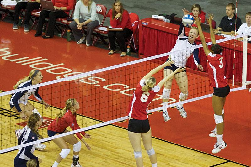Korrin Wild spikes the ball through two New Mexico defenders in the Bulldogs’ victory over the New Mexico Lobos. The Bulldogs will visit Colorado State on Thursday, then Wyoming on Friday. (Photo by Khlarissa Agee/The Collegian)