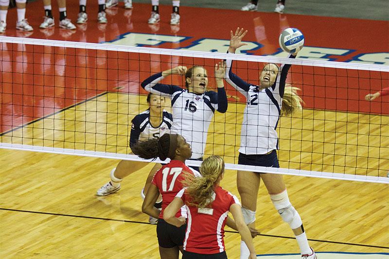 Maci Murdock (16) and Holly Franks (12) block an incoming shot by the New Mexico Lobos during the Bulldogs’ five-set victory over them last Thursday. The win was one of two Fresno State posted over the weekend. Photo by Roe Borunda/The Collegian