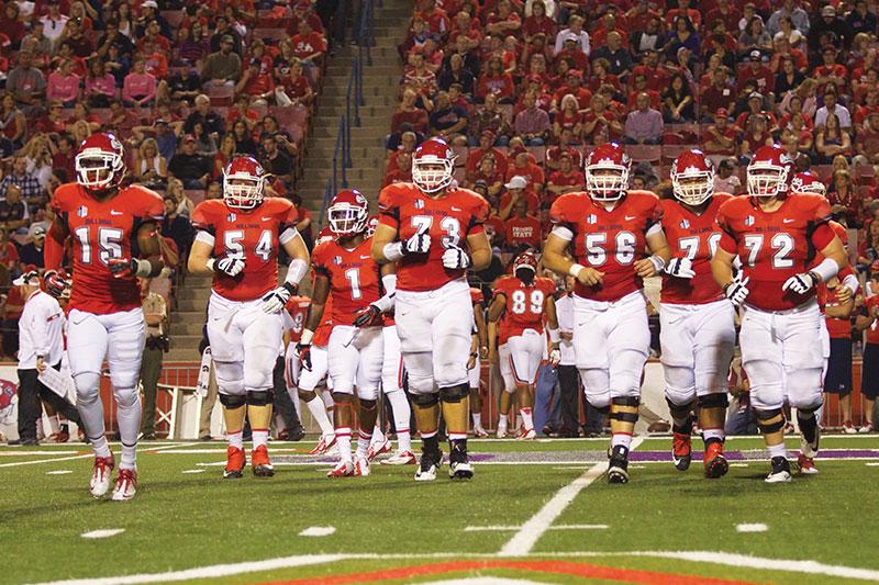 Fresno State’s offensive line heads to work during the Bulldogs’ victory over UNLV last Saturday. The Bulldogs are looking to increase their winning streak on the road at San Diego State this Saturday on ESPN2. Photo by Roe Borunda/The Collegian