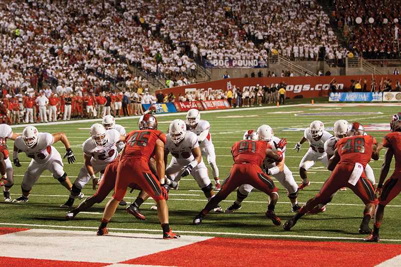 The Fresno State offensive line protects quarterback Derek Carr in the pocket in the Bulldogs’ 52-51 overtime win over Rutgers on Aug. 29 at Bulldog Stadium.