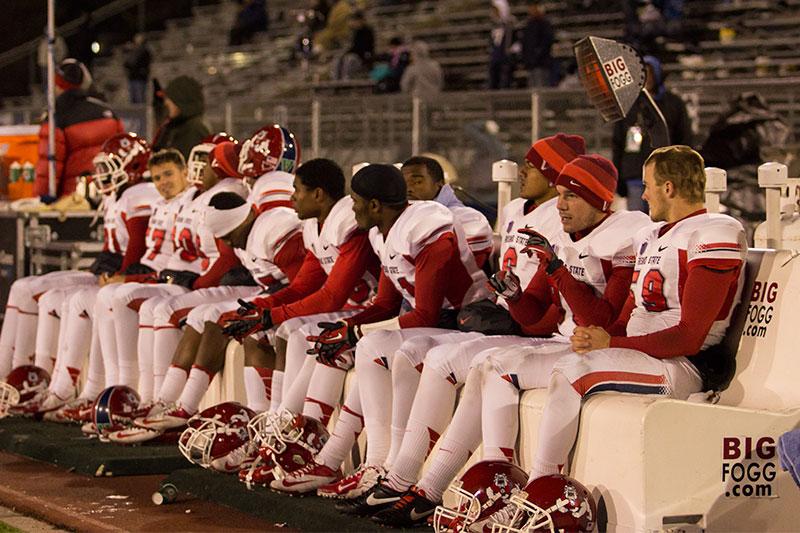 The Fresno State sideline adjusts to the cold during the Bulldogs' win at Nevada last year.