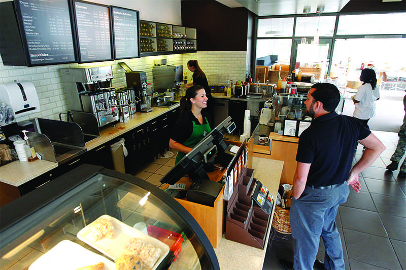 Starbucks+recently+implemented+a+feature+to+tip+baristas+when+a+customer+decides+to+pay+with+card.+%28Courtesy+of+Cary+Edmondson%29%0A%0ABaristas+busy+at+work+in+the+Henry+Madden+Librarys+Starbucks.+Ricky+Serrano%2C+the+dining+services+manager+at+the+shop%2C+said+its+busiest+time+is+9+a.m.+to+noon+or+2+p.m.