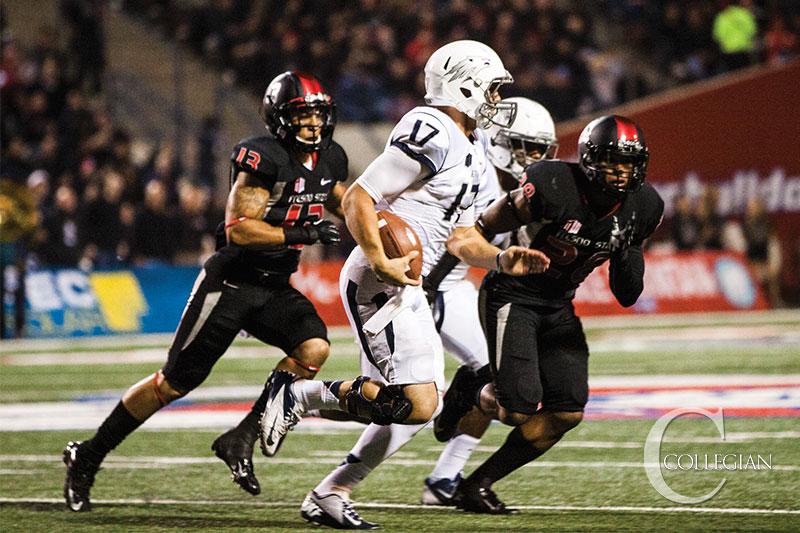 Fresno State safety Derron Smith (13) chases after Nevada quarterback Cody Fajardo during the Bulldogs Nov. 2 win over the Wolf Pack.