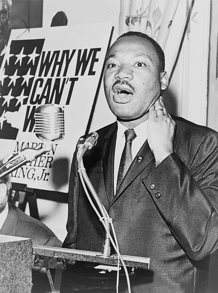 Martin Luther King, Jr., three-quarter length portrait, standing, facing front, at a press conference on June 8, 1964. / World Telegram & Sun photo by Walter Albertin.