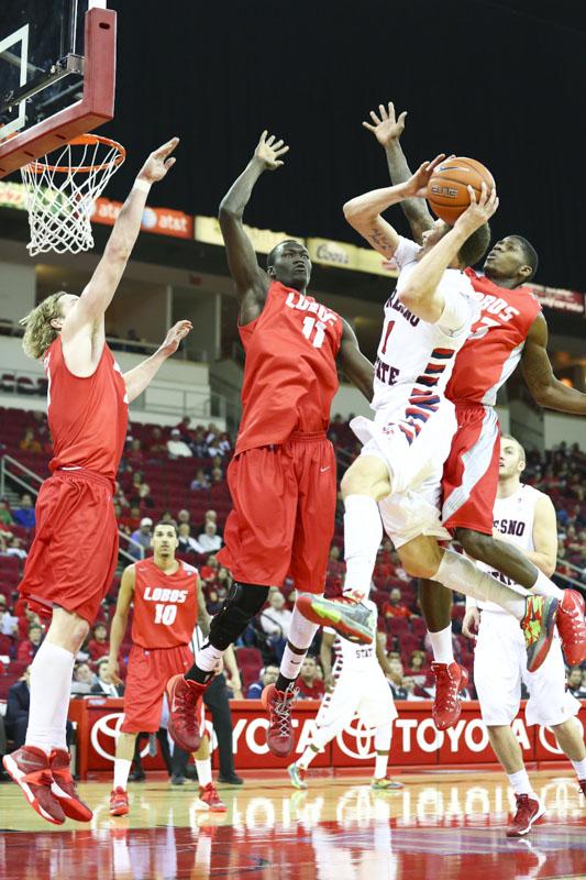 Fresno States Tyler Johnson battles three New Mexico defenders to the basket in the Bulldogs 89-78 loss last Saturday. (Photo by Matthew Vieira/The Collegian)