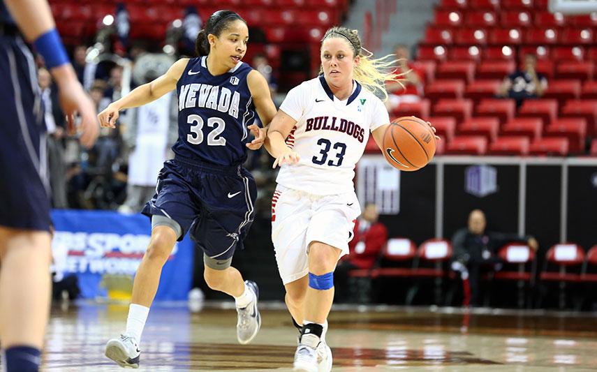 Fresno State senior Taylor Thompson takes the ball down the court in the Bulldogs semifinal victory over the Nevada Wolf Pack. Photo by Khlarissa Agee/The Collegian