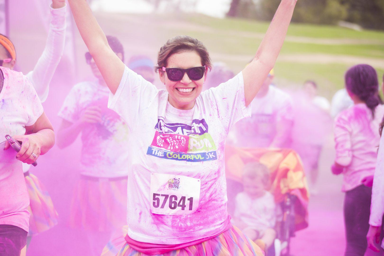 Katie Eleneke / The Collegian
A runner crosses the pink color station during The Graffiti Run.