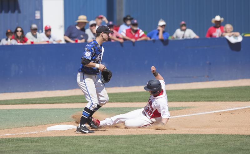 Fresno State freshman Austin Guibor slides into third base during the Dogs 11-1 victory over the Air Force Falcons. Photo by Matt Vieira/The Collegian