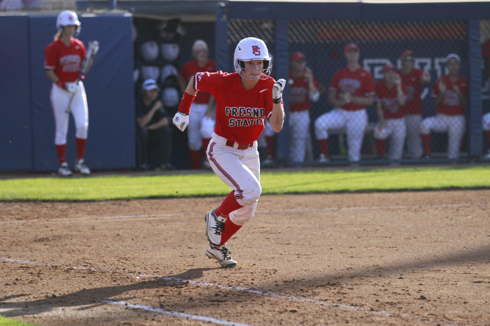 Fresno State left fielder Kapri Angotti dashes toward first base after connecting on a softball pitch. One of Angotti’s lessons taught under head coach Trisha Ford was to “hit the ball and run.” Photo by Geoff Thurner/The Collegian