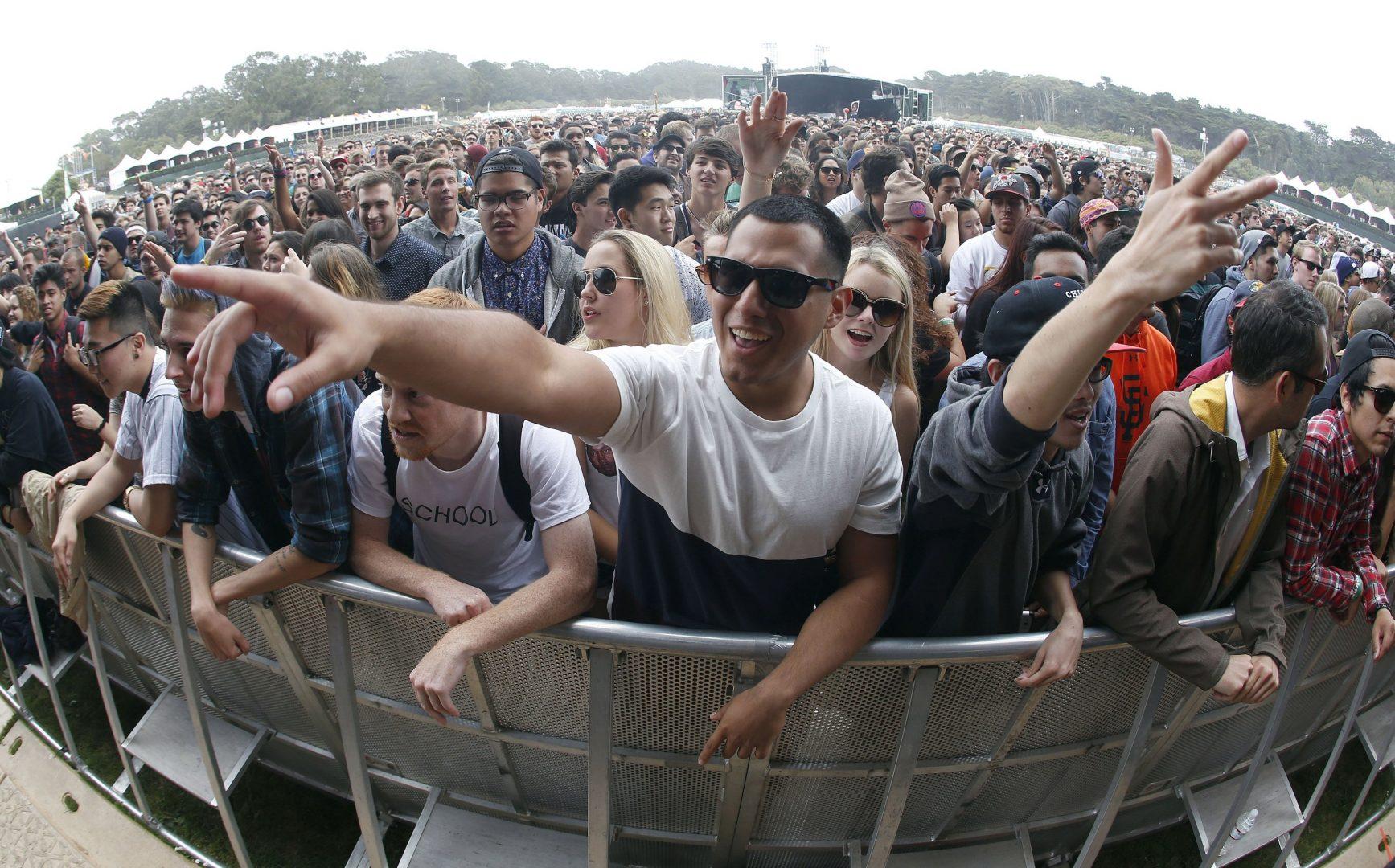 Photo by Jane Tyska / Bay Area News Group / Chris Huerta, of Pasadena, Calif., center, and others belly up to the pit during day one of the Outside Lands music festival at Golden Gate Park in San Francisco on August 8, 2014.