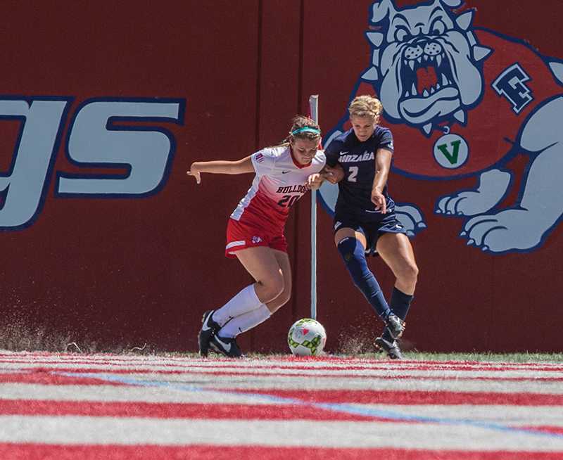 Fresno State defendser Miranda Rudolph battles Gonzaga forward Brittany Doan for the ball in Sunday's 3-0 loss. The Bulldogs begin the season 1-1 after winning their first home game against Eastern Washington. Photo by Darlene Wendels/The Collegian