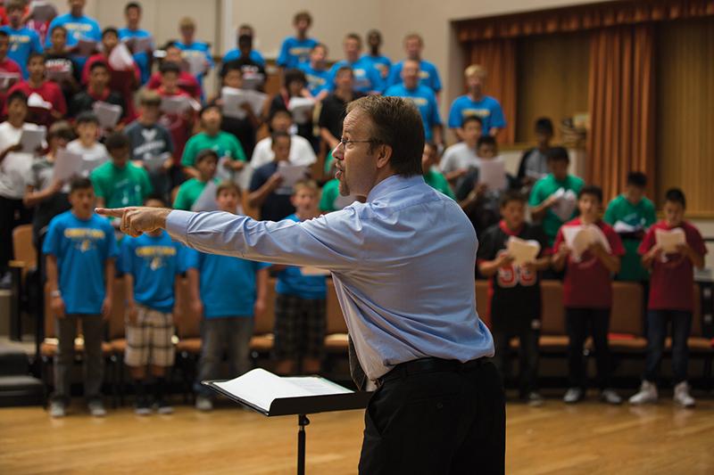 Darlene Wendels / The Collegian
Guest clinician Frank F. Eychaner directs over 200 middle school male vocalists on Thursday in the Concert Hall on campus. 