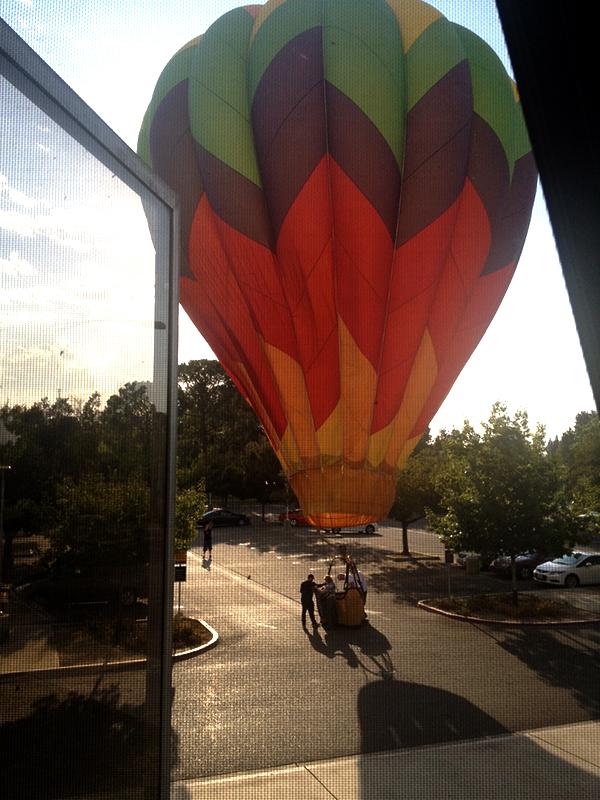 A hot air balloon landed in the Henry Madden Library parking lot on Sunday morning. Kristen Lacey / The Collegian