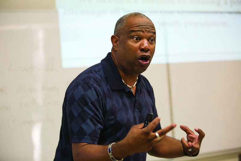Fresno pastor Booker T. Lewis speaks at a peace and conflict course at Fresno State on Thursday. Darlene Wendells / The Collegian