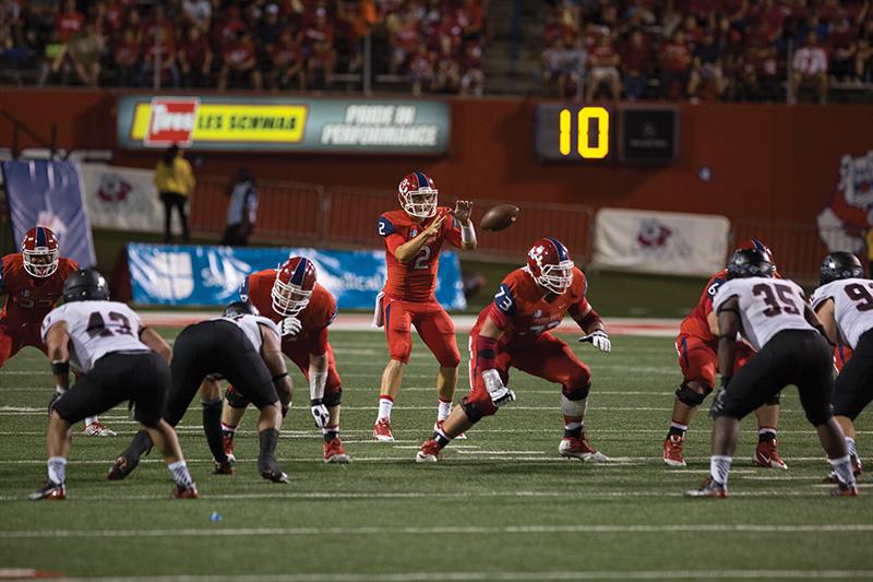 Fresno State quarterback Brian Burrell receives a snap during the ‘Dogs’ 56-16 victory over Southern Utah Sept. 20. Burrell was named the team’s No. 1 signal caller Monday. Photo by Darlene Wendels/The Collegian