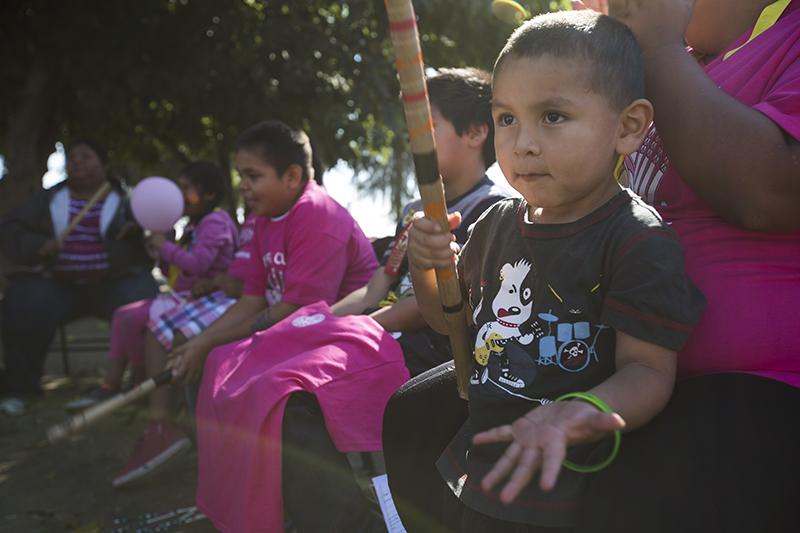 Michael Marquez,3, claps during a game for the Play for a Cure Fresno Family Hand-Game Exhibition at ONeill Park, Saturday, Oct. 18, 2014. The exhibition was held in observance of Breast Cancer Awareness Month. Darlene Wendels / The Collegian
