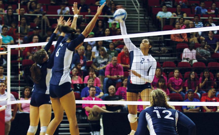 Fresno State freshman Lauren Torres (right) attempts a spike during the Bulldogs’ 3-2 loss to the Nevada Wolf Pack Thursday night at the Save Mart Center. Photo by Khlarissa Agee/The Collegian