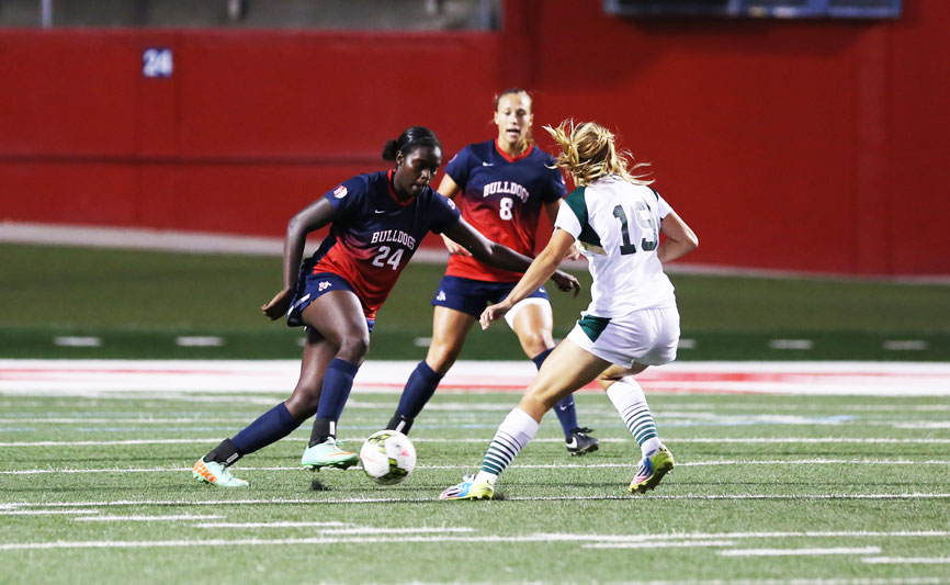 Fresno State defender Ariana Holmes (24) keeps possession of the ball against Sacramento State forward Adaurie Dayak during the Bulldogs’ 2-1 loss to the Hornets on Sept. 21. Photo by Khlarissa Agee/The Collegian
