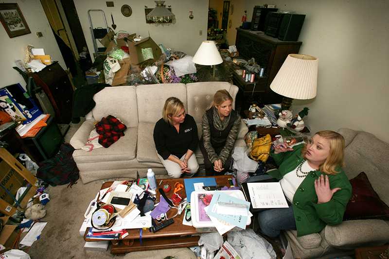 Nikki Havens, from right, Wendy Flood and Andria Berke talk about the organizing plan at the home of Jeanne Leier, November 4, 2009, in Little Canada, Minnesota. Leier is a hoarder who is seeking help both in clearing her home and in getting therapy for her condition, brought about by a traumatic event. (Joel Koyama/Minneapolis Star Tribune/MCT)