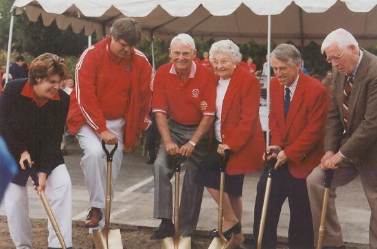 A group of people, including Earl and Muriel Smittcamp, break gound on the Smittcamp Alumni House in 1998. Photo courtesy of University Communications
