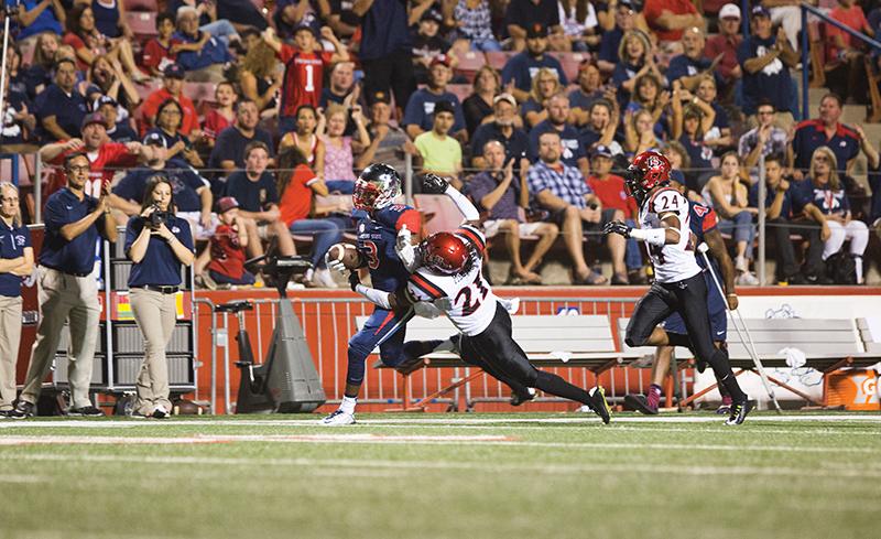 Fresno State wide receiver Josh Harper (3) dashes past San Diego State running back Na’im McGee during the ‘Dogs 24-13 victory over the Aztecs on Oct. 3.