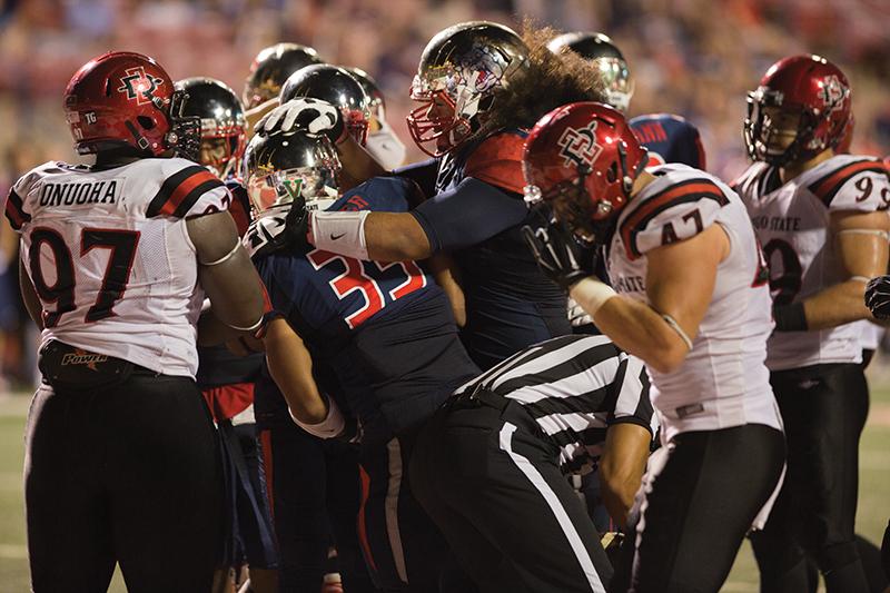 Fresno State running back Marteze Waller is congratulated by teammates after a successful run against the San Diego State Aztecs in the ‘Dogs’ 24-13 victory. The Bulldogs will attempt to win its first game since then, when San Jose State comes to town. Photo by Darlene Wendels/The Collegian
