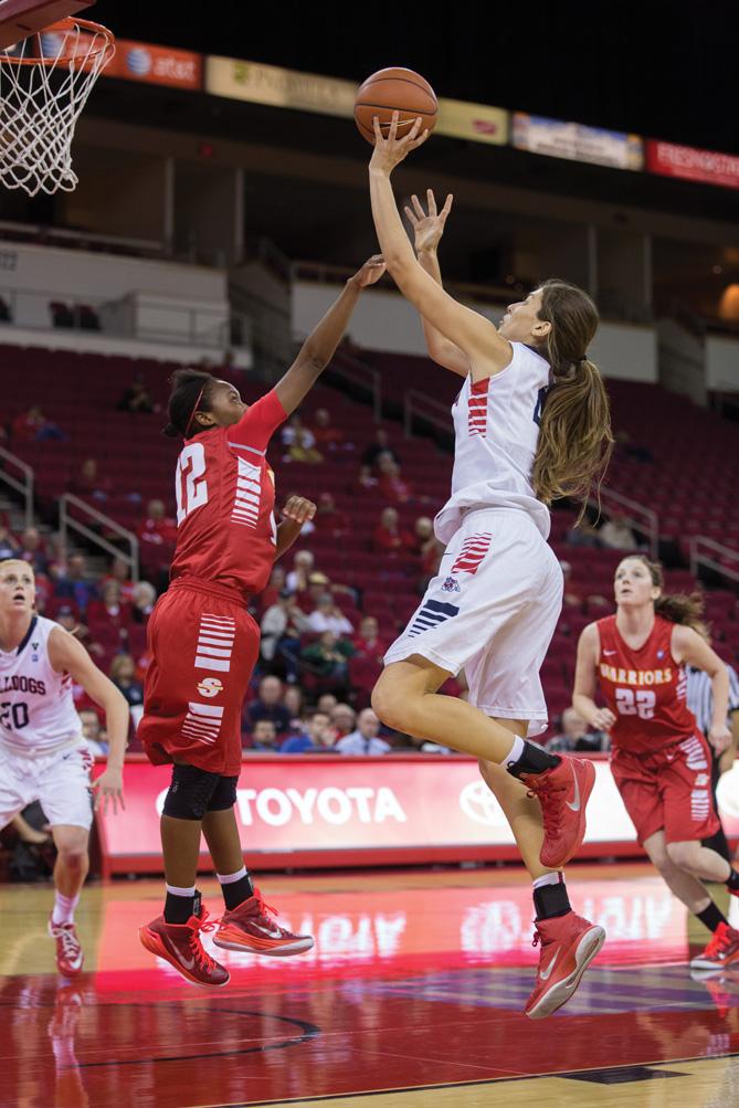 Fresno State redshirt freshman Bego Faz Davalos (right) attempts a jump shot during the Dogs 65-36 victory over Cal State Stanislaus Wednesday at the Save Mart Center. Photo by Logan Downing/The Collegian
