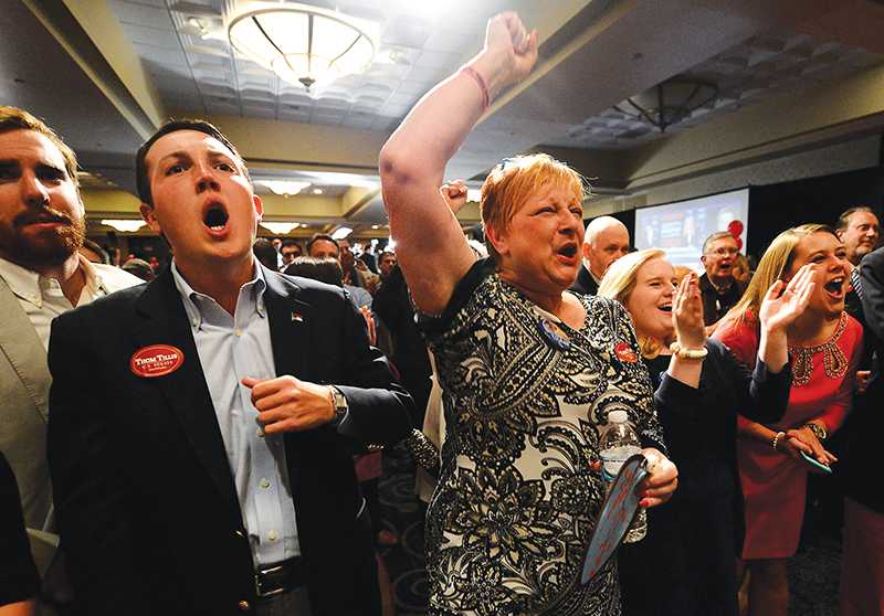 Dave Craven and Dianna Bingle cheer with other supporters of Republican U.S. Sen. candidate Thom Tillis on Tuesday, Nov. 4, 2014, at the Omni Hotel in Charlotte, N.C. (Jeff Siner/Charlotte Observer/TNS)