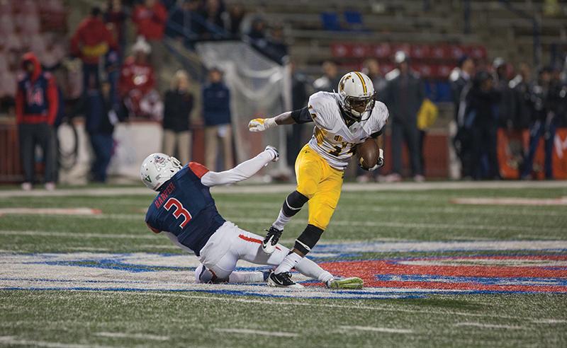 Wyoming cornerback Tyran Finley runs past Fresno State wide receiver Josh Harper (3) after intercepting a Brian Burrell pass attempt during the Dogs 45-17 loss to the Cowboys Friday at Bulldog Stadium. Photo by Darlene Wendels/The Collegian
