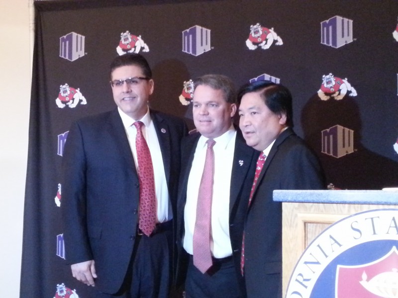 Fresno State president Joseph Castro (left) poses with new athletic director Jim Bartko (center) in the Bulldog Foundation room at the Save Mart Center Friday morning. Photo by Christopher Livingston/The Collegian
