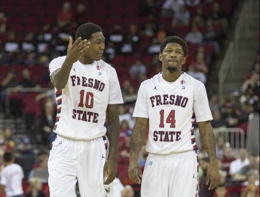 Fresno State sophomore Alex Davis (left) chats with transfer Julien Lewis (right) during the Dogs loss to the California Golden Bears Sunday at the Save Mart Center. Photo by Paul Schlesinger/The Collegian