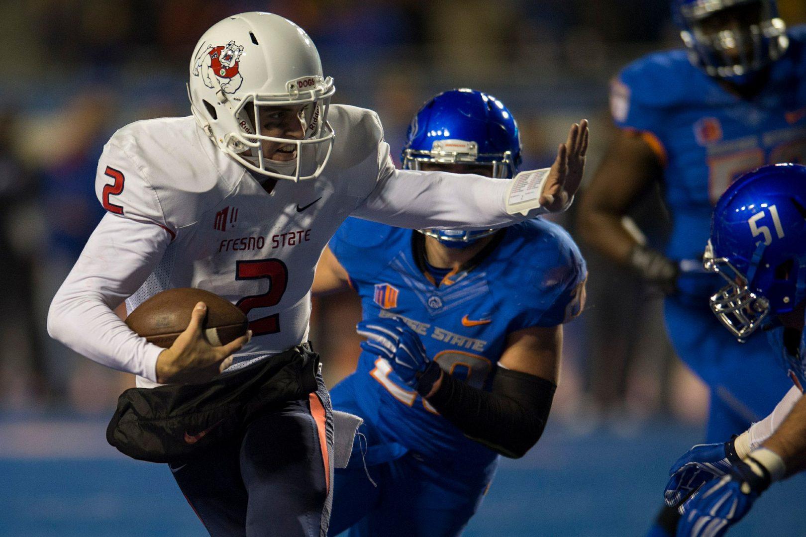 Fresno State quarterback Brian Burrell rushes through Boise States defense during the Dogs loss to the Broncos in the Mountain West Championship. Photo courtesy of NCAA Photos