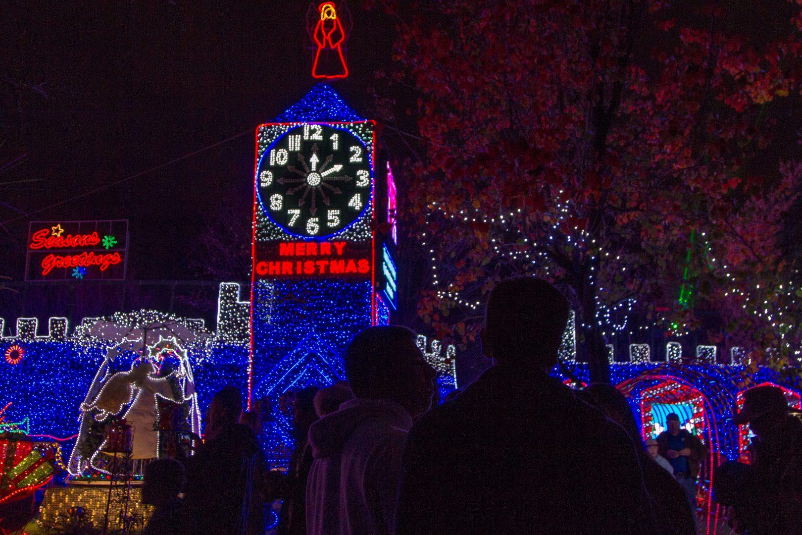 The Collegian
visitors take a look at one of the many houses decorated at Christmas Tree Lane during the first walk night on Saturday, Dec. 1. The lane will be open to the public through Christmas Day. (Photo credits to Paul Schlesinger)