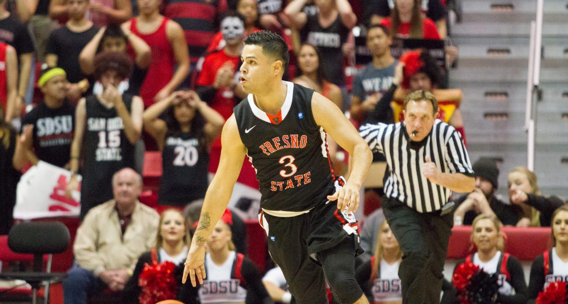 Fresno State guard Cezar Guerrero (3) dribbles the ball up the court during the Bulldogs 58-47 loss at San Diego State. (Chadd Cady/The Daily Aztec)