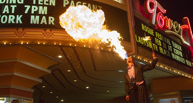 Paul Schlesinger / The Collegian
Adrian Lim of Circus Et Cetera spouts fire from his mouth during the Rogue Festival Preview Show on Thursday night at the entrance to the Tower Theater. Circus Et Cetera is performing at Full Circle Brewing Co. during the festival’s run. 