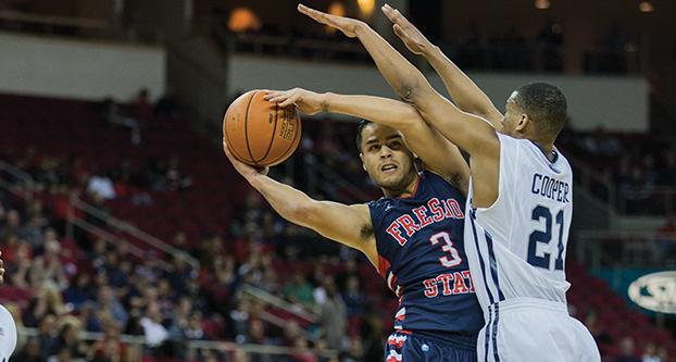 Fresno State guard Cezar Guerrero (3) looks for an open teammate in the Jan. 24 win over Nevada at Save Mart Center. (Darlene Wendels/The Collegian)