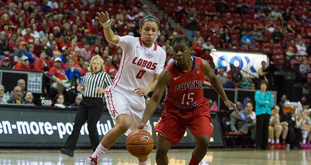 Fresno State junior guard Shauqunna Collins (right) keeps possession of the ball during the Dogs 64-53 loss to the New Mexico Lobos Wednesday night at Thomas & Mack Center in Las Vegas. (Darlene Wendels/The Collegian)