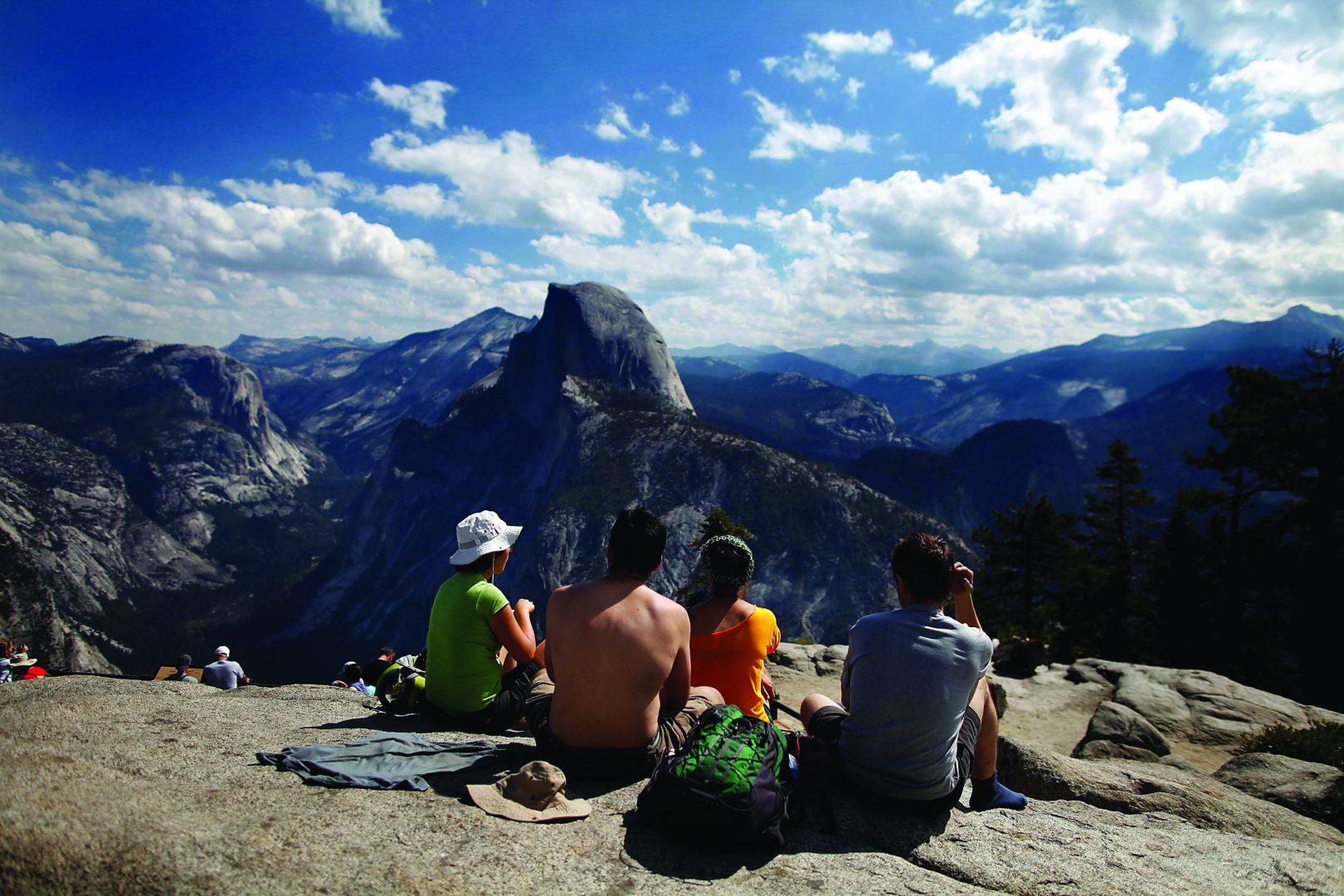 (Barbara Davidson/Los Angeles Times/TNS)
Tourists enjoy the view at Glacier Point in California’s Yosemite National Park.