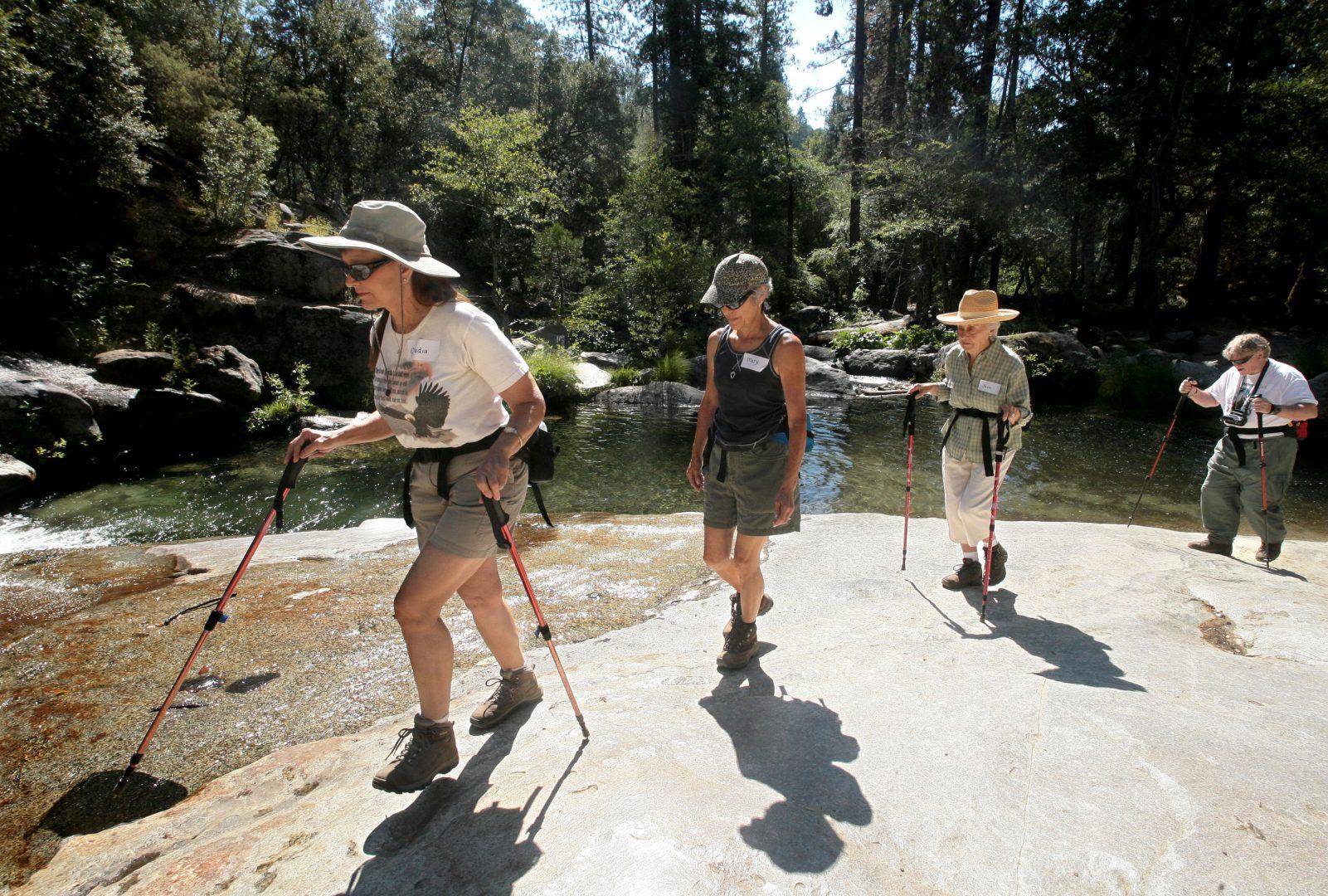John Walker / TNS
Hikers walk along Willow Creek as it spills into a pool on their way  to Angel Falls at Bass Lake, Calif. From left: Claudia VanderBie, Mary Clayton, Jean VanderBie (Claudias mother) and Jack Sheehan. 